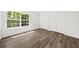 Bedroom featuring natural light, double closet, and wood-look flooring at 122 Hornby Cir, Goose Creek, SC 29445