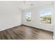 Bright bedroom with two windows and wood-look floors providing natural light at 122 Hornby Cir, Goose Creek, SC 29445