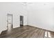 Bedroom featuring wood-look floors, bright natural light, and neutral walls at 122 Hornby Cir, Goose Creek, SC 29445