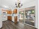 Kitchen featuring wooden cabinets, sliding glass door, and wood-look floors at 122 Hornby Cir, Goose Creek, SC 29445