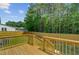 A new deck overlooks a fenced backyard with lush green grass, perfect for relaxing and entertaining at 123 Fall Creek Blvd, Summerville, SC 29483