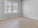 Empty bedroom with two windows and wood floor at 123 Fall Creek Blvd, Summerville, SC 29483