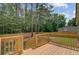 Beautiful new deck with wood railings overlooking a private wooded backyard, perfect for outdoor gatherings at 123 Fall Creek Blvd, Summerville, SC 29483