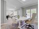 Bright dining area featuring an elegant white table, stylish chairs, and modern decor, flowing into the living room at 123 Fall Creek Blvd, Summerville, SC 29483