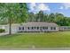 Charming single-story home with a welcoming front porch and lush green lawn at 123 Fall Creek Blvd, Summerville, SC 29483