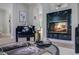 Living room fireplace with glass accents and decorative items at 123 Fall Creek Blvd, Summerville, SC 29483