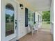 Charming front porch featuring a decorative glass door and cozy seating area at 123 Fall Creek Blvd, Summerville, SC 29483