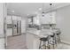 Modern kitchen featuring white cabinets, granite countertops, stainless steel appliances, and barstool seating at 123 Fall Creek Blvd, Summerville, SC 29483