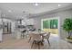 Eat-in kitchen with granite countertops, stainless steel appliances, and a sliding door to the wooden deck at 123 Fall Creek Blvd, Summerville, SC 29483