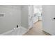 Functional laundry room includes storage, access to the utility hookups, and leads into a renovated kitchen at 123 Fall Creek Blvd, Summerville, SC 29483