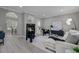 Spacious living room featuring a cozy fireplace, contemporary furnishings, and stylish decor at 123 Fall Creek Blvd, Summerville, SC 29483