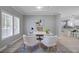 Bright office space featuring stylish decor, natural light, and a glimpse of the kitchen at 123 Fall Creek Blvd, Summerville, SC 29483