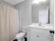 This clean bathroom features a shower with curtain and a vanity at 124 Long Trail Way, Moncks Corner, SC 29461