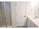 Bathroom with glass enclosed shower, modern vanity, and neutral color palette at 124 Long Trail Way, Moncks Corner, SC 29461