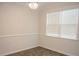 Bright bedroom with hardwood floors, modern lighting, and a large window offering ample natural light at 124 Long Trail Way, Moncks Corner, SC 29461