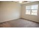 Carpeted bedroom featuring a window and ample natural light at 124 Long Trail Way, Moncks Corner, SC 29461