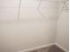 Walk-in closet with standard shelving and neutral carpeted flooring at 124 Long Trail Way, Moncks Corner, SC 29461