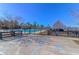 Gated community pool area, featuring accessibility parking and a charming white pool house, ensuring a convenient and enjoyable experience at 124 Long Trail Way, Moncks Corner, SC 29461