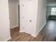 Clean hallway with wood-look flooring and neutral paint leading to other rooms at 124 Long Trail Way, Moncks Corner, SC 29461
