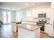 Bright, modern kitchen boasting stainless steel appliances, granite countertops, and ample cabinet space at 124 Long Trail Way, Moncks Corner, SC 29461