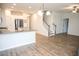 Spacious living area with hardwood floors, a staircase, and an open kitchen concept at 124 Long Trail Way, Moncks Corner, SC 29461