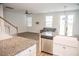 Open-concept living space showcasing hardwood floors, modern decor, and abundant natural light at 124 Long Trail Way, Moncks Corner, SC 29461