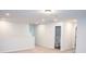 Carpeted loft area with neutral walls and access to a bathroom at 124 Long Trail Way, Moncks Corner, SC 29461