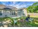 Large backyard featuring a fire pit, outdoor seating, and an ample grassy area at 129 Mockernut Dr, Ladson, SC 29456