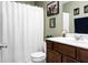 Bathroom featuring shower, toilet and sink with cabinet and decorations at 129 Mockernut Dr, Ladson, SC 29456
