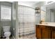 Clean, well-lit bathroom includes shower, vanity with storage, and a window for natural light at 129 Mockernut Dr, Ladson, SC 29456