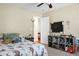 Inviting bedroom with a ceiling fan, dinosaur bedspread and display shelves at 129 Mockernut Dr, Ladson, SC 29456