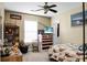 Nicely sized bedroom with a ceiling fan and decorated with many games at 129 Mockernut Dr, Ladson, SC 29456