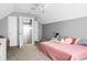 Sloped ceiling bedroom with carpet, soft grey walls, and closet space at 129 Mockernut Dr, Ladson, SC 29456