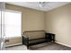 Bedroom with beige walls, neutral carpet, ceiling fan, and a black futon at 129 Mockernut Dr, Ladson, SC 29456