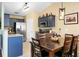 Inviting dining area featuring a wooden table with seating and stylish overhead lighting fixtures at 129 Mockernut Dr, Ladson, SC 29456