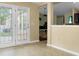 Open dining area with light-toned tile, large glass doors, and view of living area at 129 Mockernut Dr, Ladson, SC 29456