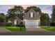 Charming single-Gathering home with a well-manicured lawn and two-car garage at dusk at 129 Mockernut Dr, Ladson, SC 29456