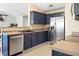 Modern kitchen with stainless steel appliances, blue cabinets, and ample counter space at 129 Mockernut Dr, Ladson, SC 29456