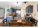 Bright, open kitchen with stainless steel appliances, blue cabinets and a view to the dining area at 129 Mockernut Dr, Ladson, SC 29456