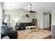 Comfortable living room features hardwood floors, ceiling fan, and comfortable seating at 129 Mockernut Dr, Ladson, SC 29456