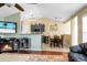 Open-concept living room and kitchen with hardwood floors, modern lighting, and comfortable seating at 129 Mockernut Dr, Ladson, SC 29456