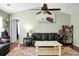 Living room featuring hardwood floors, neutral walls, ceiling fan, and comfortable seating at 129 Mockernut Dr, Ladson, SC 29456