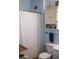 Small, coastal bathroom features a white shower curtain and ample cabinet space at 1300 Park West Blvd # 919, Mount Pleasant, SC 29466