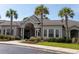 Welcoming clubhouse exterior with palm trees and manicured landscaping at 1300 Park West Blvd # 919, Mount Pleasant, SC 29466