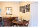 Inviting dining room featuring wooden furniture, a mirror, and a charming gallery wall at 1300 Park West Blvd # 919, Mount Pleasant, SC 29466