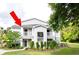 Gray two-story condo with a lawn, shrubs and trees at 1300 Park West Blvd # 919, Mount Pleasant, SC 29466