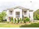 Inviting two-story condo with double balconies, lush landscaping, and a well-maintained lawn at 1300 Park West Blvd # 919, Mount Pleasant, SC 29466