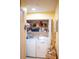 Functional laundry area with washer, dryer, and shelving for organization at 1300 Park West Blvd # 919, Mount Pleasant, SC 29466