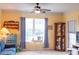 Cozy living room with carpet, ceiling fan, blue accents, and large window for natural light at 1300 Park West Blvd # 919, Mount Pleasant, SC 29466