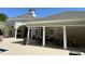 Covered poolside lounge area with tables and chairs, offering a relaxing space at 1300 Park West Blvd # 919, Mount Pleasant, SC 29466